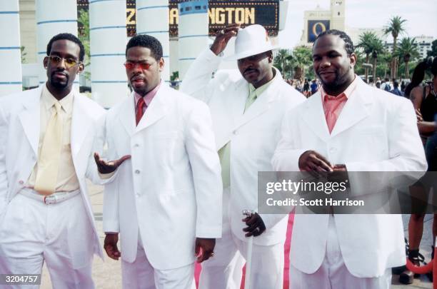 American R&B group Boyz II Men pose outdoors on a red carpet at the 20th Anniversary of Black Entertainment Television at Bally's Hotel and Casino,...