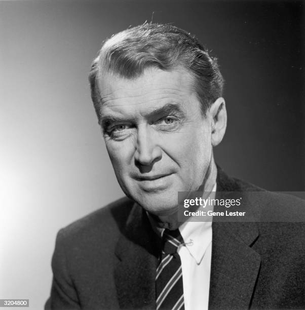 Studio headshot portrait of American actor James Stewart in a jacket and tie.