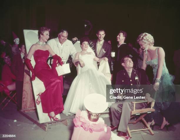 American actor Mitzi Gaynor, director Walter Lang, actor and singer Ethel Merman, vocal director Ken Darby, actors Donald O'Connor, Johnnie Ray, and...