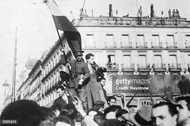 Soldier raises the Spanish flag after the Republican victory in the 1931 elections, which resulted in the declaration of the second republic and the...
