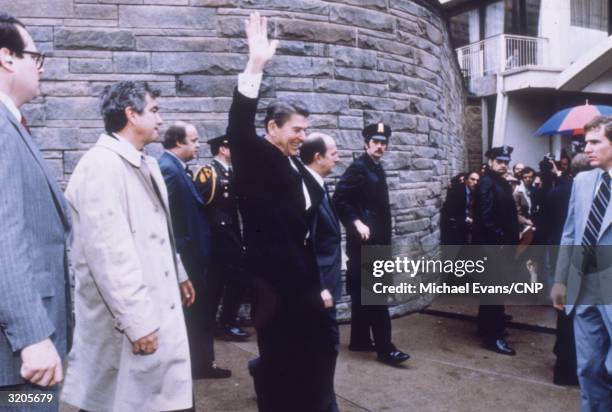 President Ronald Reagan waves to the crowd shortly before the assassination attempt which took place outside the Hilton Hotel in Washington.