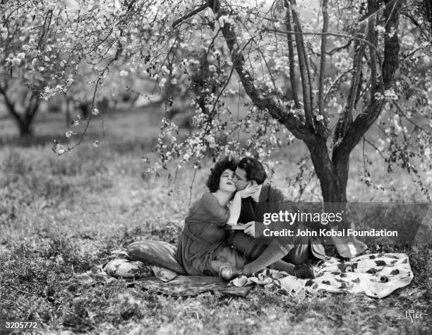 Alla Nazimova and Rudolph Valentino are the ill-fated lovers in 'Camille', directed by Ray C Smallwood and based on the novel 'La Dame aux Camelias'...