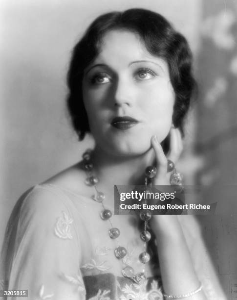 Promotional headshot of Canadian-born actor Fay Wray, wearing a beaded necklace, late 1920s.