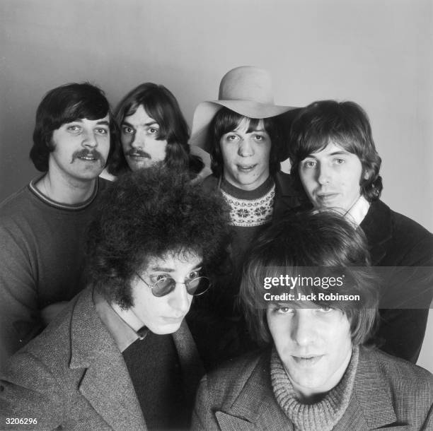 Studio portrait of the British rock group Procol Harum. Front, left to right: songwriter Keith Reid, drummer B.J. Wilson. Back, left to right: singer...