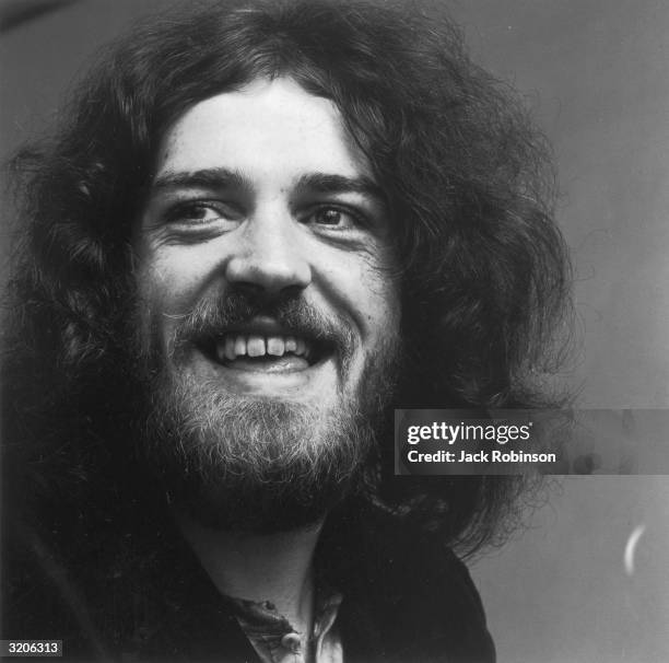 Headshot of British rock singer Joe Cocker smiling.