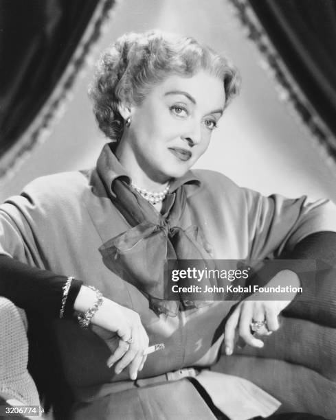 Bette Davis plays the vengeful Joyce Ramsey in 'Payment on Demand', directed by Curtis Bernhardt.