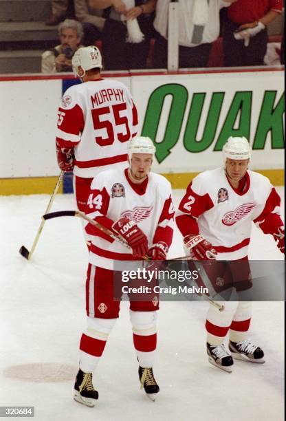 Anders Eriksson and Viacheslav Fetisov of the Detroit Red Wings look on during a Stanley Cup Finals game against the Washington Capitals at the Joe...