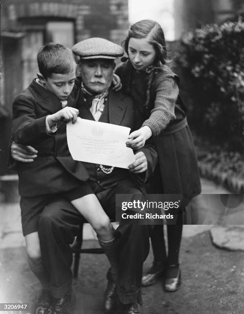 Year-old Thomas Jenkins with the parchment certificate he received from the Royal Humane Society for rescuing a child from the weir at Rogerstone,...