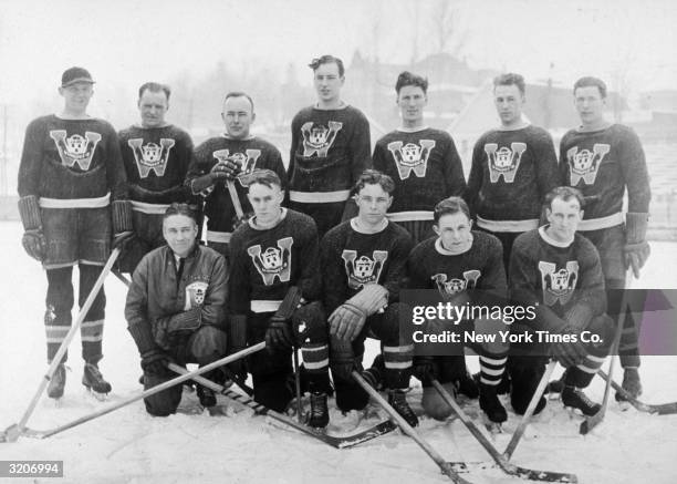 Group portrait of the Canadian Olympic ice hockey team, Lake Placid, New York. Bottom: Coach Hughes, C Victor Lundquist, N Romeo Rivers, Walter G...