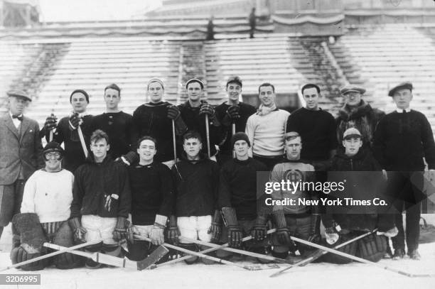 The United States Olympic ice hockey team poses at Lake Placid Stadium, New York. Bottom: Frank Farrell, Jack Bent, Buzz Hollock, John Cookman, Doug...