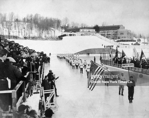 The United States Olympic team passing by Governor Franklin Delano Roosevelt during the procession at the opening ceremony of the Olympic Winter...