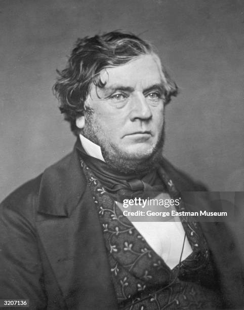 Studio portrait of an unidentified middle-aged man wearing a jacket with a brocade vest and a cravat.