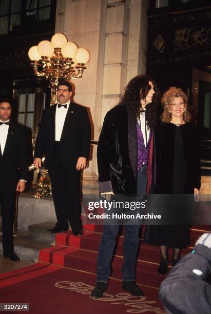 American radio host Howard Stern standing with his wife, Alison, outside the main entrance to the Plaza Hotel, New York City.