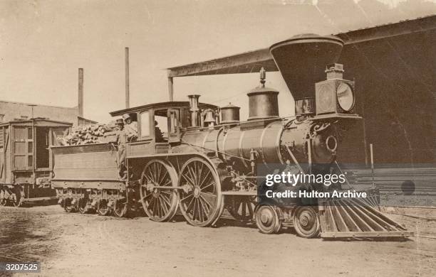 The large smoke stacked steam engine 'Pioneer', the first locomotive used in California. The wood burning vehicle was nicknamed 'The Elephant'...