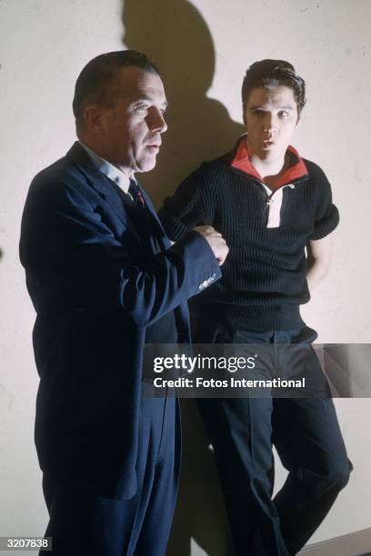 Portrait of American television personality Ed Sullivan and musician Elvis Presley during a press conference before the latter's first appearance on...