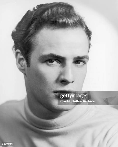 Studio portrait of actor Marlon Brando wearing a turtleneck sweater.