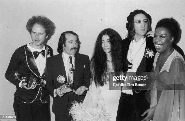 Art Garfunkel, Paul Simon, Yoko Ono, John Lennon and Roberta Flack pose together backstage at the Grammy Awards, Uris Theater, New York City....