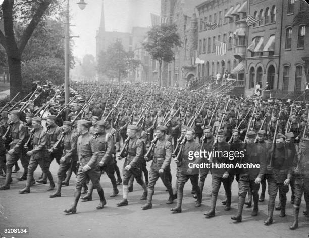 World War I victory parade of armed soldiers on Broad Street in Newark, NJ.