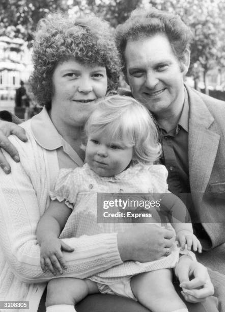 Portrait of Louise Joy Brown, the first test-tube baby, with her parents in England.