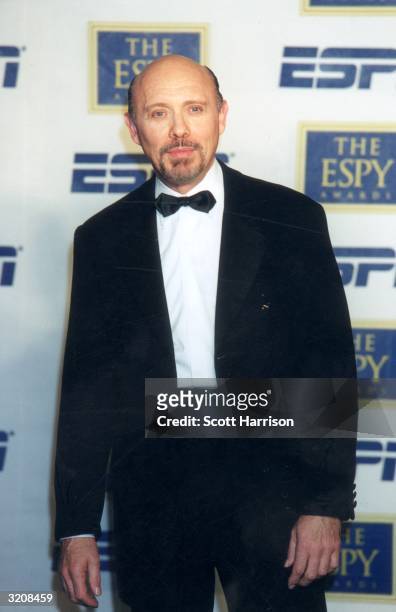 American actor Hector Elizondo smiles as he stands in front of a wall of logos at the eighth annual ESPY Awards, where he was a presenter, MGM Grand...
