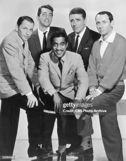 The members of the Rat Pack posing in a full-length studio portrait. L-R: Frank Sinatra , Dean Martin , Sammy Davis, Jr , Peter Lawford , and Joey...