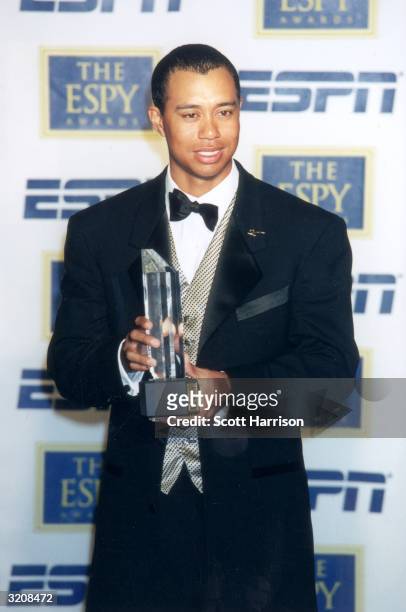American golfer Tiger Woods holds one of the three ESPYs he won at the eighth annual ESPY Awards, MGM Grand Hotel, Las Vegas, Nevada. Woods won the...