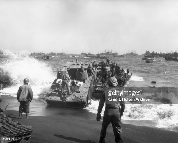 Full-length view of Amphibious Corps landing craft operations on Yellow Beach, Iwo Jima, Japan, World War II.
