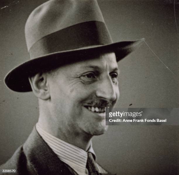Passport headshot of Anne Frank's father, Otto wearing a hat. Taken from her photo album, Amsterdam, Holland.
