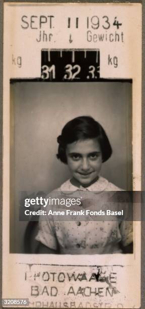 Portrait of Margot Frank, the sister of Anne Frank, taken in a photo booth with her weight and the date the photo was taken printed on the border,...