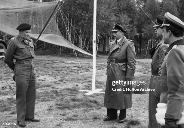 German envoy of Admiral Hans-Georg von Friedeburg , General Eberhard Kinzel and General Ernst Busch meeting with Field Marshall Bernard L. Montgomery...