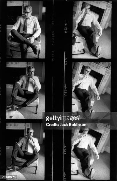 Contact sheet showing a series of photographs of British actor Michael Caine sitting in an armchair smoking a cigarette, reading, and talking, in an...