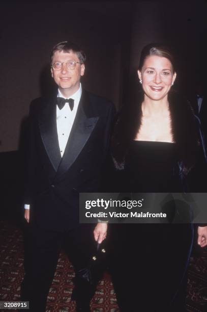 Microsoft CEO Bill Gates and his wife Melinda stand together, wearing formal attire, New York City.