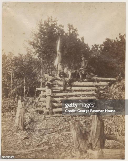 Full-length image of a group of Union soldiers perched atop a wooden signal tower on Elk Mountain, overlooking the battlefield at Antietam, Maryland....