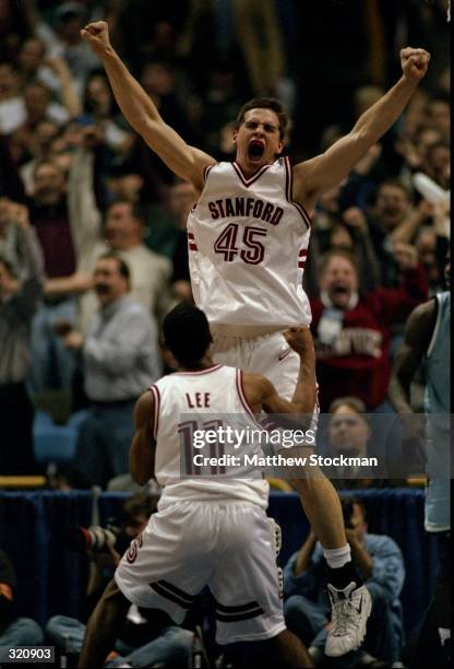 Forward Mark Madsen and guard Arthur Lee of the Stanford Cardinal in action during an NCAA Tournament game against the Rhode Island Rams at the Kiel...