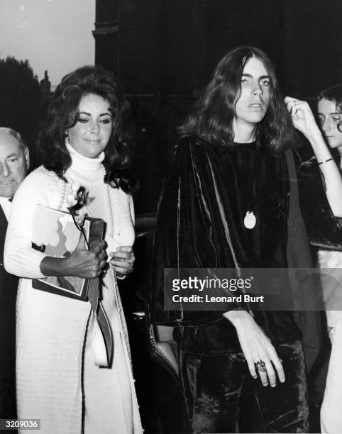 Liz Taylor arriving at Caxton Hall with her son Michael Wilding on the day of his wedding to Beth Clutter.