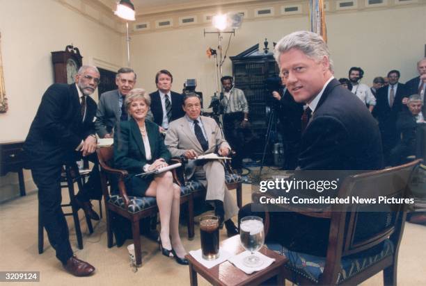 United States president Bill Clinton sits with '60 Minutes' reporters Ed Bradley, Morley Safer, Steve Krofft, Lesley Stahl, and Mike Wallace in the...