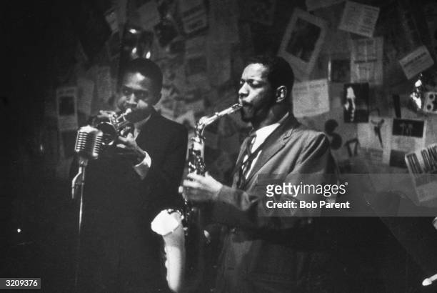 Ornette Coleman plays the saxophone and Don Cherry plays the trumpet at the 5 Spot Cafe, New York City.