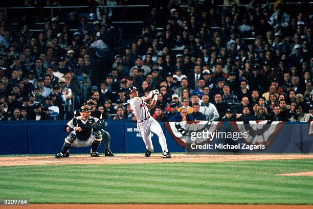 Center fielder Andruw Jones of the Atlanta Braves hits his first career home run in the second inning of Game 1 of the 1996 World Series against the...