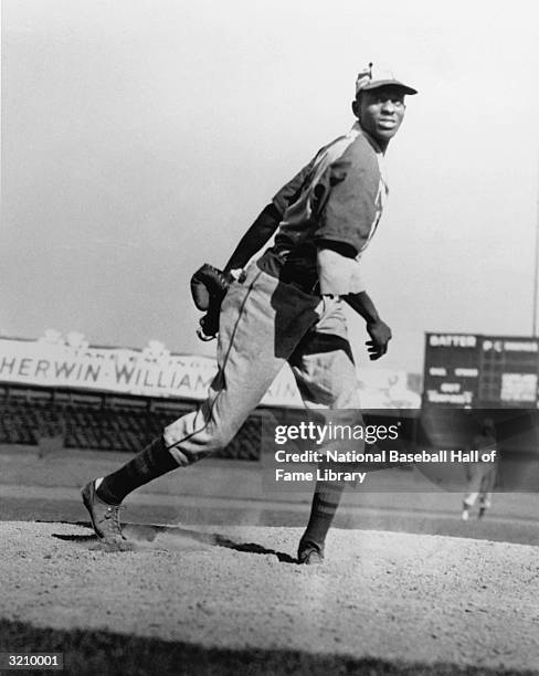 Leroy "Satchel" Paige of the Negro League Kansas City Monarchs poses for an action portrait. Paige played for the Kansas City Monarchs from...