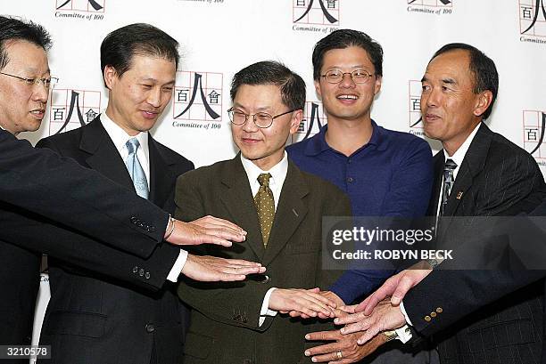 Yahoo.com co-founder and Director Jerry Yang and Dr. David Ho , CEO of the Aaron Diamond AIDS research Center and one of the world's best known AIDS...