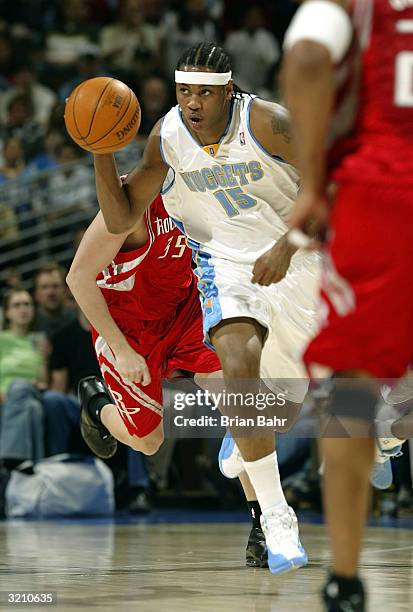 Carmelo Anthony of the Denver Nuggets takes off with a turnover against the Houston Rockets at the Pepsi Center on April 2, 2004 in Denver, Colorado....