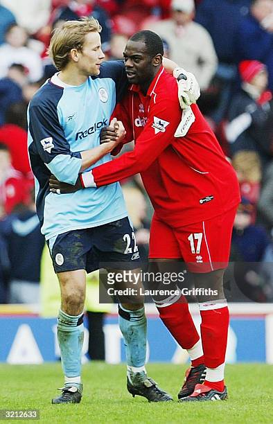 Jussi Jaaskelainen of Bolton congratulates his old team mate Michael Ricketts of Boro during the FA Barclaycard Premiership match between...