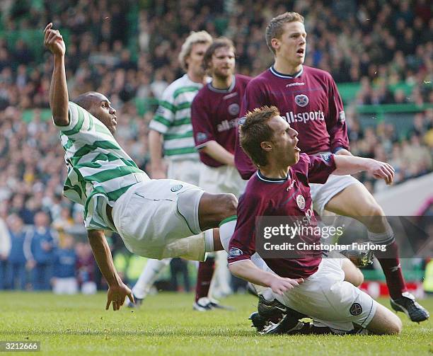 Celtic's Didier Agathe scores the equaliser in injury time during the Scottish Premier League match between Celtic and Hearts at Celtic Park on April...