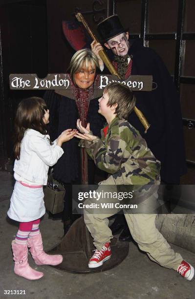 Linda Robson and her children attend the celebrity unveiling of brand new ?1m ride "Traitor: Boat Ride To Hell" where visitors are ushered aboard by...