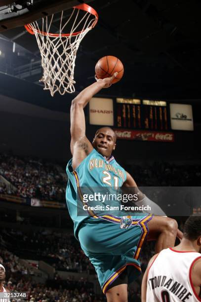 Jamaal Magloire of the New Orleans Hornets goes up for a dunk during a game against the Portland Trail Blazers on April 3, 2004 at the Rose Garden...