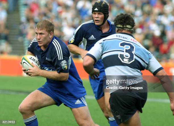 Derren Witcombe with ball followed by Daniel Braid of the Blues during the Super 12 match between the Auckland Blues and the NSW Waratahs at Eden...