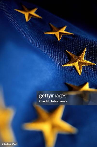embroidered european union (eu) flag, close-up of stars - europaflagge stock-fotos und bilder