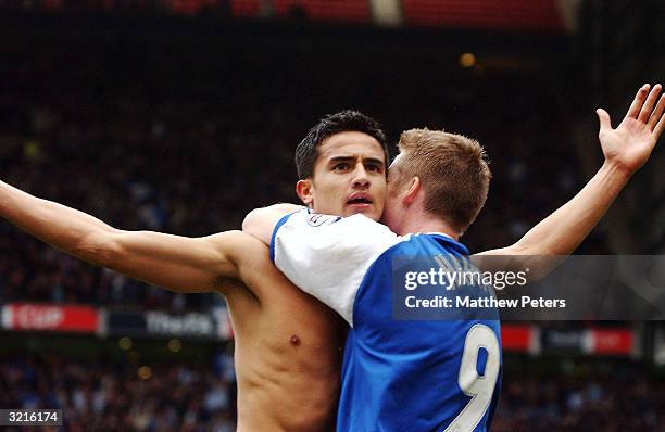 Tim Cahill of Millwall celebrates scoring the first goal with Neil Harris during the AXA FA Cup match between Sunderland and Millwall at Old Trafford...