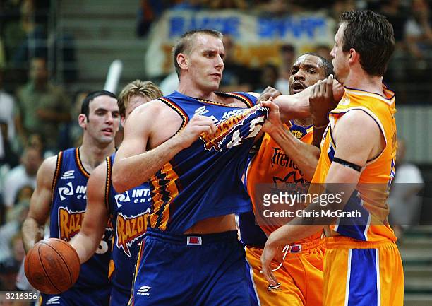 Simon Dwight of the Razorbacks and Matt Nielsen of the Kings exchange words during Game four of the NBL Finals series between the Sydney Kings and...