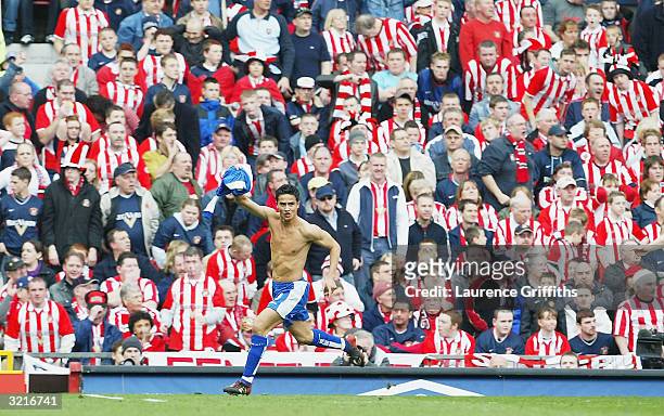 Tim Cahill of Millwall celebrates his goal in front of the Sunderland fans during the FA Cup Semi Final match between Sunderland and Millwall at Old...